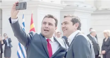  ??  ?? Zaev (left) makes a selfie with Tsipras prior to their meeting in Skopje. — AFP photo