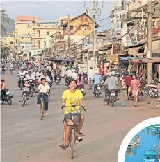  ??  ?? ● Cyclists travel through Duong Dong and, inset, fishing boats on Phu Quoc Island