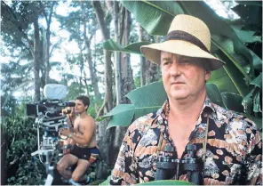  ??  ?? Gadney in Jamaica on the set of Goldeneye (1989), a television film about Ian Fleming: he wrote the script and played a cameo role as James Bond, the ornitholog­ist who inspired the name of Fleming’s character; (right) with his wife the food writer Fay...