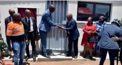  ?? ?? BHC Board Chairman Mr. M Gabana officially handing over the kitchen keys to Minister of Defence, Justice and Security also
the area MP for Gabane-Mankgodi