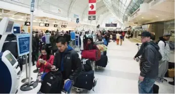  ?? AARON VINCENT ELKAIM/THE CANADIAN PRESS FILE PHOTO ?? Airports can’t be immune from accountabi­lity though blame often gets deflected, Shawn Micallef writes.