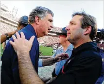  ?? GETTY IMAGES ?? Georgia Tech coach Paul Johnson (left) might occasional­ly defeat Georgia’s Kirby Smart — as he did last season — but no Yellow Jackets coach is likely to out-recruit the Bulldogs.