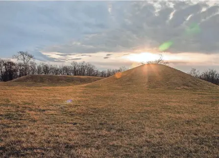  ?? ROBERT MCGRAW/GAZETTE ?? The sun rises Friday morning over the mounds located at the Hopewell Culture National Historical Park in Chillicoth­e.
