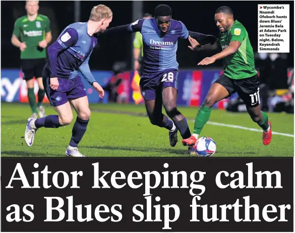  ??  ?? Wycombe’s Nnamdi Ofoborh hunts down Blues’ Jeremie Bela at Adams Park on Tuesday night. Below, Keyendrah Simmonds