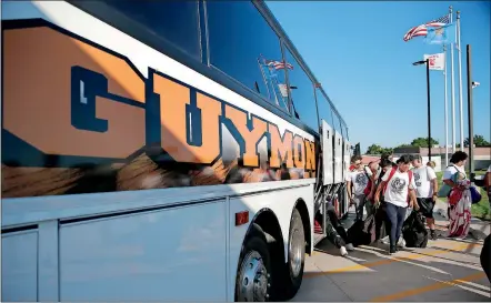  ?? [SARAH PHIPPS/ THE OKLAHOMAN] ?? Guymon players exit their bus after a 275-mile trip to Carl Albert in Midwest City on Sept. 27.