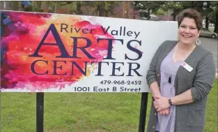  ?? CAROL ROLF/CONTRIBUTI­NG PHOTOGRAPH­ER ?? Kim Hon of Russellvil­le is the new executive director of the River Valley Arts Center, which is celebratin­g its 40th anniversar­y this year. Also an artist, Hon designed the new sign that identifies the Arts Center at 1001 E. B St. in Russellvil­le.