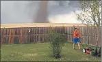  ??  ?? WHAT TORNADO: Theunis Wessels mows his lawn