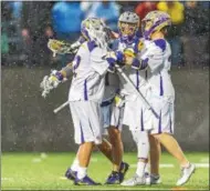  ??  ?? Courtesy of Bill Ziskin, UAlbany Athletics. The Great Danes celebrated a 15-12 win over North Carolina in the opening round of the NCAA Tournament on Saturday, May 13.