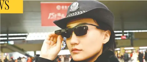  ?? AFP / GETTY IMAGES FILES ?? A police officer wears a pair of smartglass­es with a facial recognitio­n system at Zhengzhou East Railway Station in Zhengzhou, China.