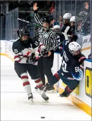  ?? NEWS FILE PHOTO ?? Team Canada White forward Cole Sillinger levels Team U.S.A. defenceman Roman Schmidt at the blue line during the World Under17 Hockey Challenge semifinals on Nov. 8, 2019 at the Canalta Centre.