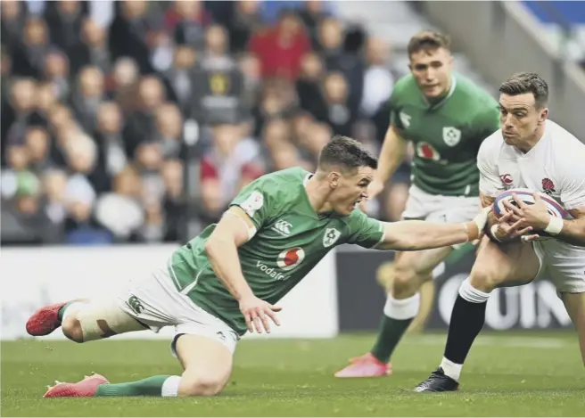  ??  ?? 0 George Ford , main image, crosses the line to score England’s first try in their 24-12 victory over Ireland yesterday. Top right, Elliot Daly beats Jacob Stockdale to the ball to