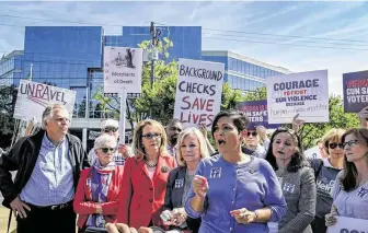  ?? Washington Post file photo ?? Former Rep. Gabrielle Giffords, center, attends a rally in September outside NRA headquarte­rs in Fairfax County, Va. Her gun safety group is looking to sway Texas elections after victories this week.