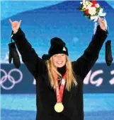  ?? Photo: AFP ?? Zoi Sadowski Synnott poses with her historic medal.