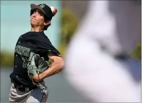  ?? WILL LESTER —
STAFF PHOTOGRAPH­ER ?? Damien senior Nathan Ries shut out Upland on three hits while walking five in the Spartans’
3-0 victory on Wednesday in a Baseline League game at Memorial Park in Upland.