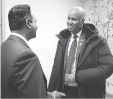  ?? NICK BRANCACCIO ?? Ahmed Hussen, right, minister of immigratio­n, refugees and citizenshi­p, speaks Wednesday with Windsor-Essex Regional Chamber of Commerce president Rakesh Naidu at the chamber office. Hussen later spoke at the University of Windsor School of Creative Arts about the private refugee sponsorshi­p program.