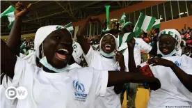  ?? ?? Girls from the Minawao Refugee Camp celebrate watching Nigeria in Cameroon