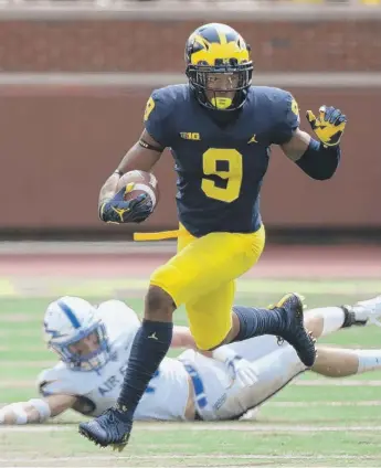  ?? | GETTY IMAGES ?? Donovan Peoples- Jones returned a punt 79 yards for a TD in the third quarter against Air Force.