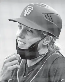  ?? KELLEY L. COX/USA TODAY SPORTS ?? As she leaves the field after the first inning, Alyssa Nakken reflects on the history she made July 21 coaching first base for the Giants.