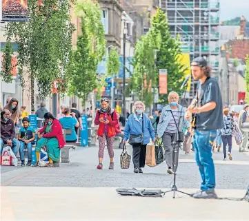  ??  ?? RETAIL WOES: Shoppers in Perth High Street. Picture by Steve MacDougall.