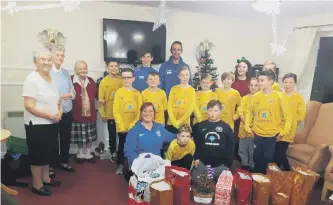  ??  ?? Velocity Phoenix under-11s team with residents at Hylton View Care Home.