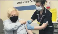  ?? PICTURE: PA WIRE ?? LIFESAVER: Prime Minister Boris Johnson receives his first dose of AstraZenec­a vaccine administer­ed by Lily Harrington.