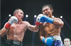  ?? PROVIDED TO CHINA DAILY ?? Biegezhati Suosaileha­n, a southpaw middleweig­ht from Dezhou, Shandong province, pounds Thailand’s Chaiwat Mueanphong en route to a majority decision in their bout at the Internatio­nal Boxing Federation’s Silk Road Champions Tournament last week in...