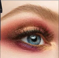  ??  ?? Eye make-up look with pink, gold and purple eyeshadow.