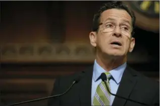  ?? JESSICA HILL/ THE ASSOCIATED PRESS ?? Connecticu­t Gov. Dannel P. Malloy delivers his budget address to members of the house and senate inside the Hall of the House at the state Capitol in Hartford.