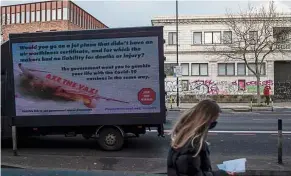  ??  ?? Should spreading false informatio­n about vaccines like this advertisem­ent in London be made into a crime? — Bloomberg