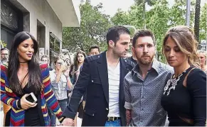 ?? — AP ?? Our real trophies: Barcelona’s Lionel Messi (second from right) and his girlfriend Antonella Roccuzzo (right) arriving for an event next to Cesc Fabregas (centre) and his girlfriend Daniella Semaan in Barcelona on Wednesday.