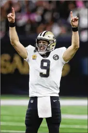  ?? CHRIS GRAYTHEN / GETTY IMAGES ?? Saints quarterbac­k Drew Brees reacts after breaking the NFL’s career passing yardage record against the Redskins on Oct. 8 in New Orleans.
