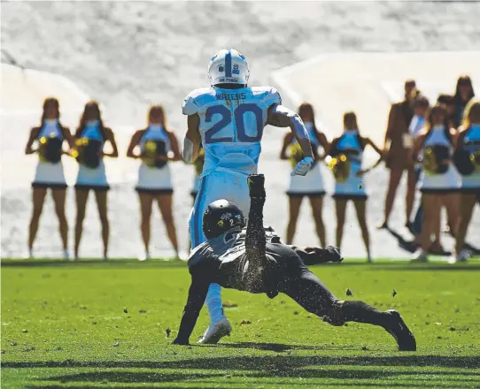  ?? Hyoung Chang, The Denver Post ?? Air Force wide receiver Benjamin Waters beats Colorado safety Mikial Onu as he runs for an 81-yard touchdown Saturday.