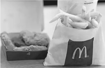  ?? — WP-Bloomberg photo ?? Chicken McNuggets and small order of french fries at a McDonald’s restaurant in Phoenix, Arizona, on Oct 21, 2017.