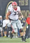  ?? GEORGIA PHOTO BY PERRY MCINTYRE ?? Offensive lineman Cade Mays looks for someone to block as receiver Matt Landers runs with the ball during Georgia’s 30-6 opening win at Vanderbilt on Aug. 31.