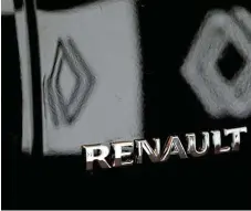  ?? /Reuters ?? New look: The Renault logo seen on the boot of a Triber, its seven-seater model, at a launch event in New Delhi on Tuesday. Renault has less than a 2% share of India’s thriving car market and is planning more investment­s.