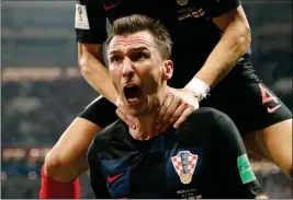  ?? ASSOCIATED PRESS ?? CROATIA’S MARIO MANDZUKIC celebrates after scoring his side’s second goal during the semifinal match between Croatia and England at the World Cup in the Luzhniki Stadium in Moscow, Russia, Wednesday.