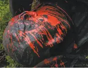  ?? Jungho Kim / Special to The Chronicle ?? The statue of Junipero Serra is covered in red paint after protesters pulled it to the ground in Golden Gate Park on Friday.