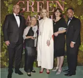  ??  ?? Richard and Jenny Weatherly (left) and Vanessa and Matt Dunbabin (right) receive the 2018 Green Carpet Eco Stewardshi­p Award from Cate Blanchett at La Scala, on the closing night of Milan Fashion Week.