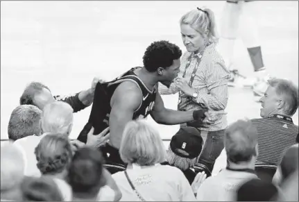  ?? LACHLAN CUNNINGHAM/GETTY-AFP ?? Raptors guard Kyle Lowry yells at a fan who shoved him during Game 3 of the 2019 NBA Finals.