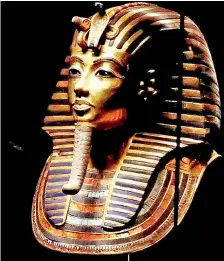  ?? ?? Tutankhamu­n's solid gold funeral mask has become an emblem for modern Egypt