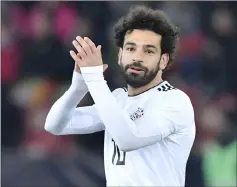  ??  ?? Egypt’s Mohamed Salah applauds during an internatio­nal friendly against Portugal at Letzigrund stadium in Zurich. Portugal captain Cristiano Ronaldo scored two stoppage time goals to steal a 2-1 win over Egypt after Salah had given the African side the...
