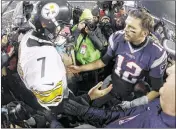  ?? ROB CARR / GETTY IMAGES ?? New England quarterbac­k Tom Brady is congratula­ted by Pittsburgh counterpar­t Ben Roethlisbe­rger (7) after the Patriots’ victory.