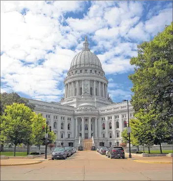  ?? MIKE DE SISTI / MDESISTI@JOURNALSEN­TINEL.COM ?? The Wisconsin State Capitol in Madison: Tying the two largest cities in the state more closely together would aid economic developmen­t.