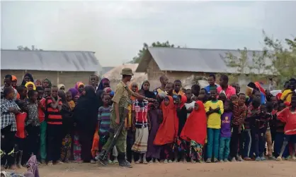  ??  ?? Refugees stand in line at Kenya’s sprawling Dadaab refugee complex. Photograph: Tony Karumba/AFP