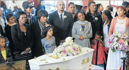  ?? Picture: SINO MAJANGAZA ?? LIFE CUT SHORT: Family members of the murdered Parkside toddler Jayde Amber Veldman surround her little coffin during her funeral service at the New Life Centre in Buffalo Flats on Saturday. Veldman was later laid to rest at the Buffalo Flats Cemetery