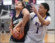  ?? (NWA Democrat-Gazette/J.T. Wampler) ?? North Little Rock’s Garin Freeman (1) and Mona Keita of Bentonvill­e West fight for control of the basketball Tuesday during the Lady Charging Wildcats’ 66-36 victory over the Lady Wolverines in the Class 6A girls state basketball tournament at Bulldog Arena in Fayettevil­le. For more photos, visit arkansason­line.com/310gbasket­ball/.