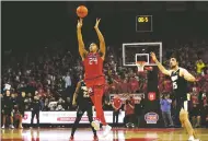  ?? NOAH K. MURRAY/ASSOCIATED PRESS ?? Rutgers forward Ron Harper Jr. lets go of his game-winning shot against No. 1 Purdue on Thursday.