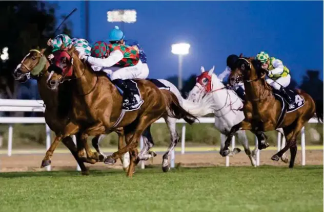  ??  ?? ↑
Somoud, ridden by Pat Cosgrave, races towards the finish line to win 2200m Group 1 Emirates Championsh­ip in Abu Dhabi on Sunday.