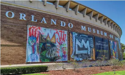  ?? ?? Signs for the Jean-Michel Basquiat exhibit outside the Orlando Museum of Art, on 25 March 2022. The show closed after FBI agents raided the museum in June 2022, having received a tip that the works were fakes. Photograph: Orlando Sentinel/TNS