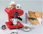  ?? Associated Press ?? ■ An Illy X1 iperEspres­so Anniversar­y 1935 Machine and Illy Art Collection espresso, cappuccino and coffee mugs. Two types of capsules are available for the machine—one for espresso and one for brewed coffee.